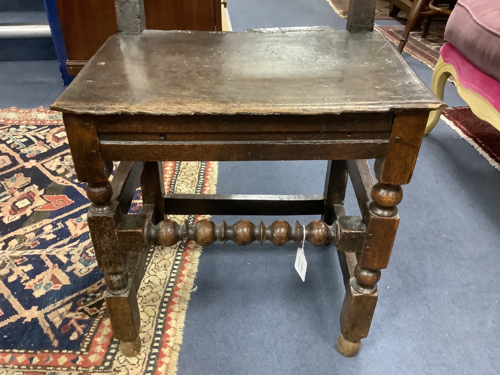 An 17th century oak back stool with lozenge carved decoration, width 48cm, depth 38cm, height 96cm